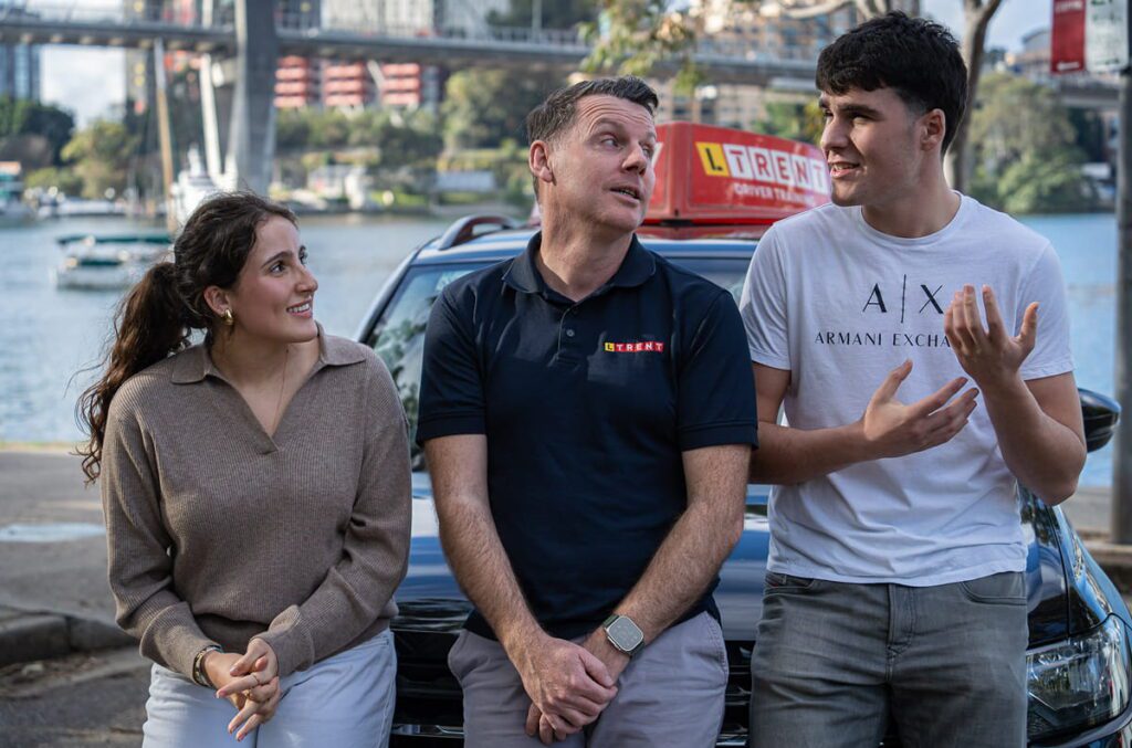 LTrent driving instructor speaking with learner drivers about building confidence and handling real driving situations in NSW