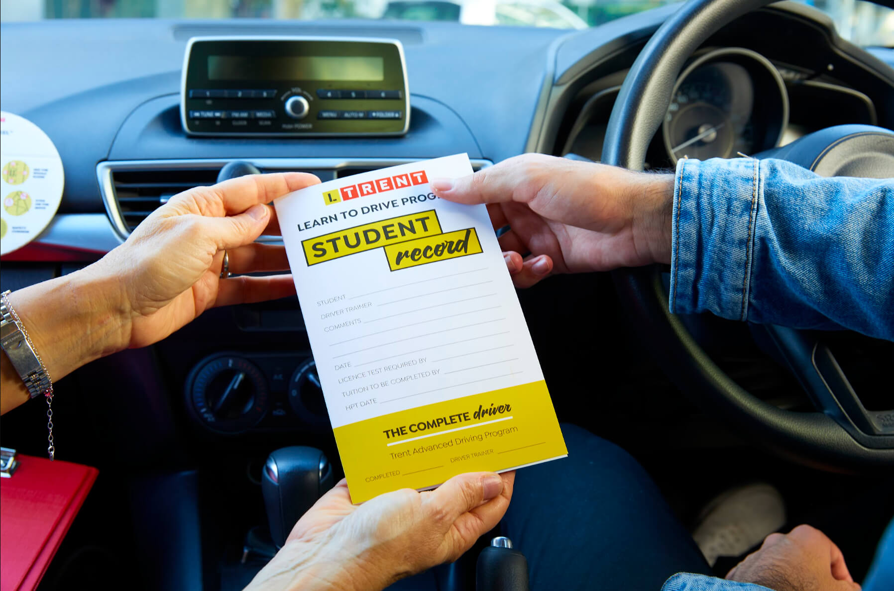 LTrent instructor reviewing a learner driver's student record during a structured driving lesson.