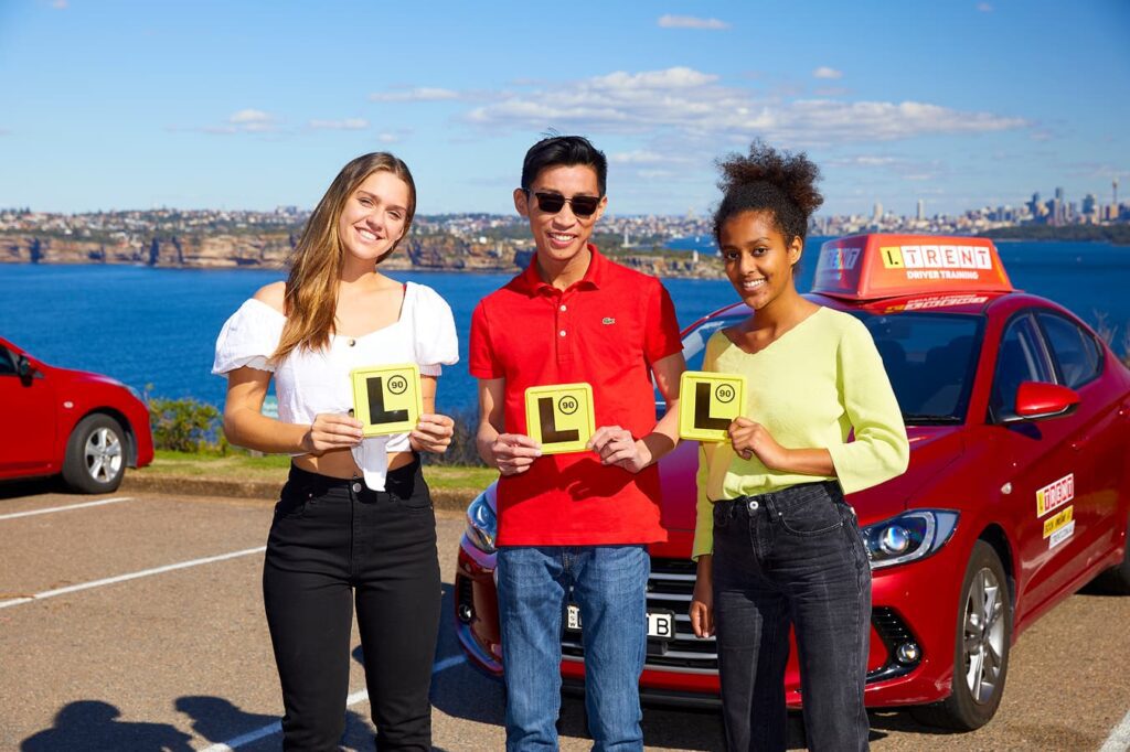 New drivers celebrating after successfully passing their driving test with LTrent Driver Training.