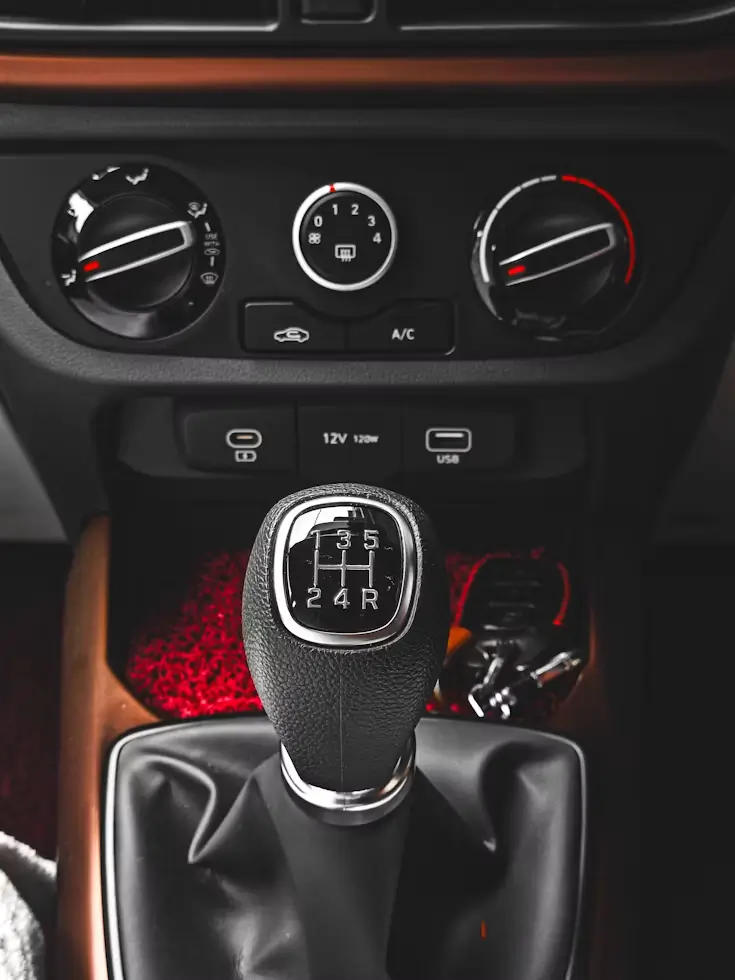 Close-up of a manual gear stick used during manual driving lessons.