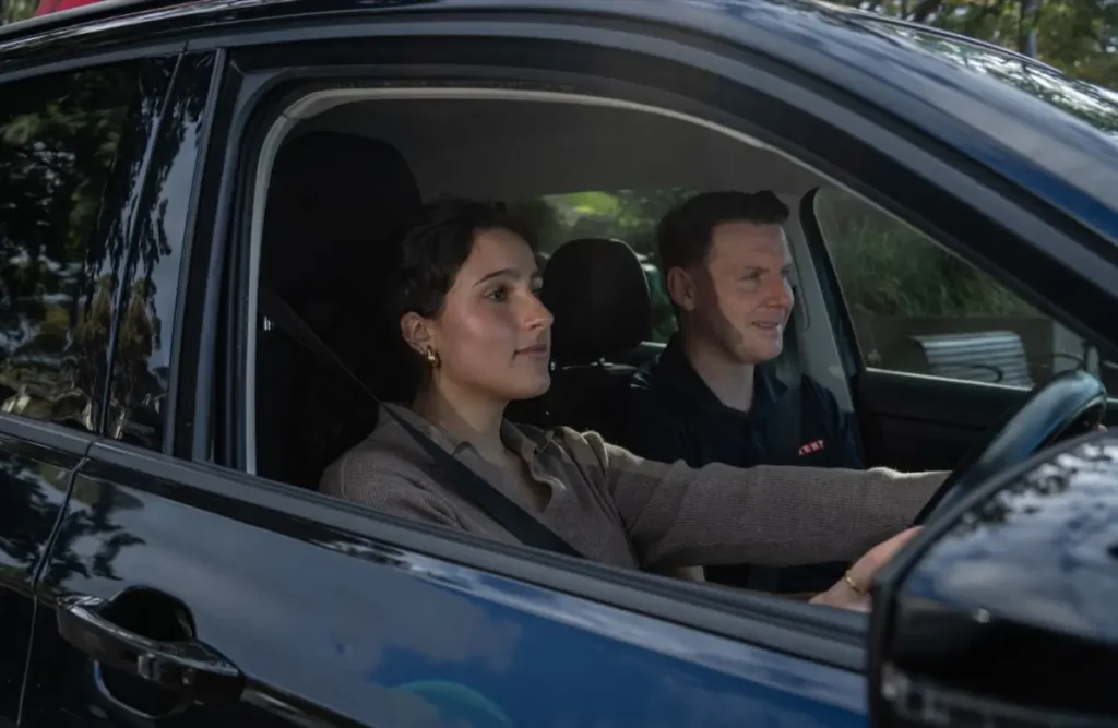 Learner driver developing good driving habits during a professional lesson.