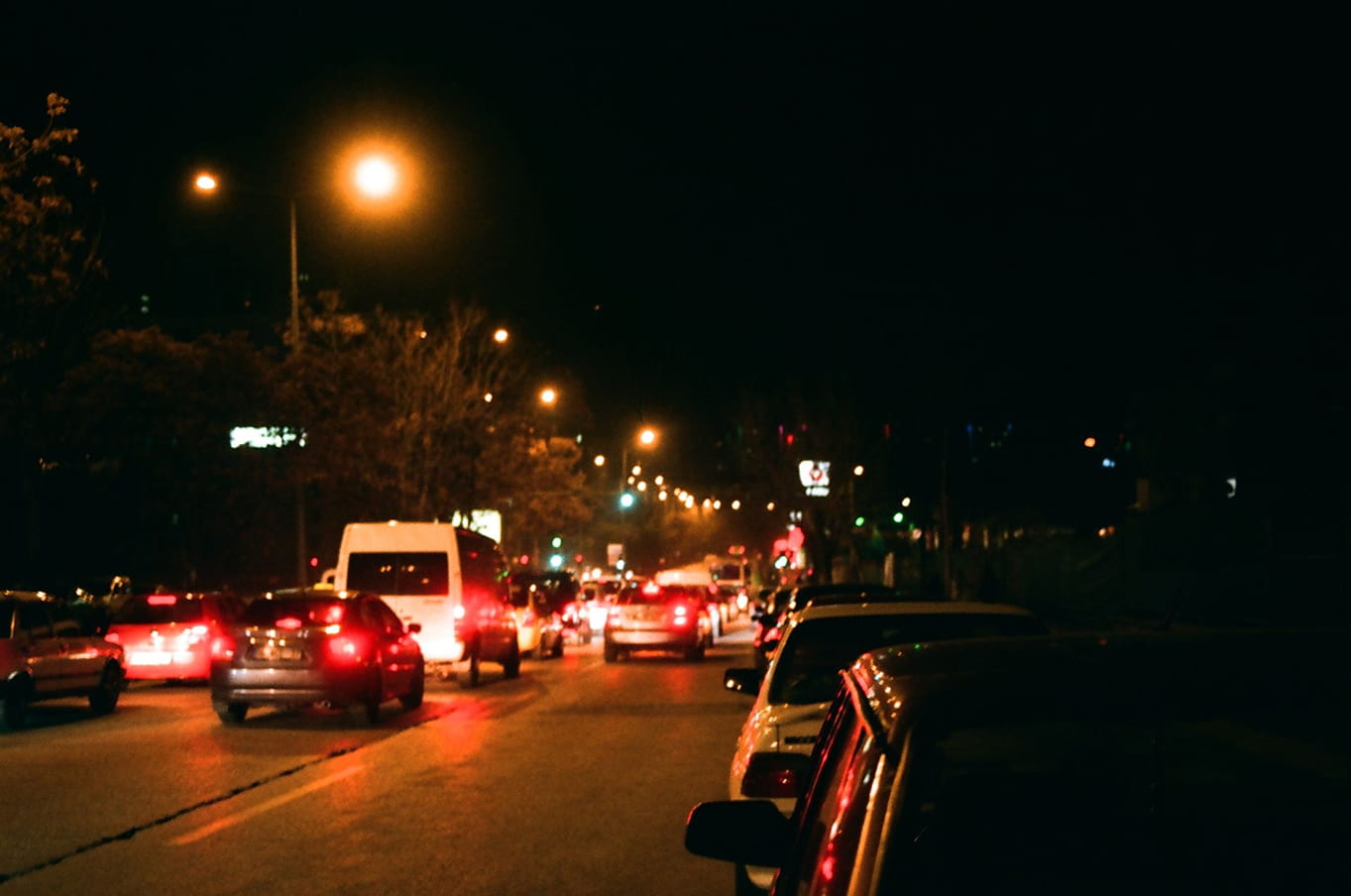 Cares on the road during nighttime.